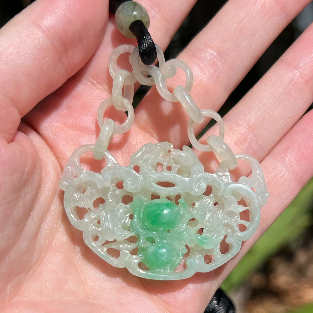 Carved Mottled Green Jade Devils Work Pendant with Birds and Plums